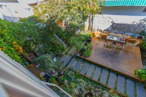 Un jardín fuera de Honglin Houseg虹林的小院 防疫整栋 古城里温馨私家小院 享受大理慢时光 树下喝茶聊天 烧烤娱乐自助厨房 休闲好去处