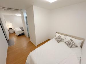 Krevet ili kreveti u jedinici u okviru objekta K9 Myeongdong Hotel