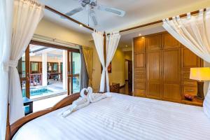 Postel nebo postele na pokoji v ubytování 3 Bedroom Pool Villa in Great Location CV3