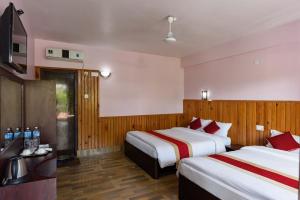 Ένα ή περισσότερα κρεβάτια σε δωμάτιο στο Hotel Monalisa Chitwan