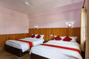 Ένα ή περισσότερα κρεβάτια σε δωμάτιο στο Hotel Monalisa Chitwan