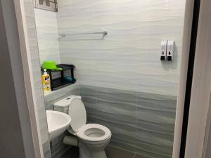 a small bathroom with a toilet and a sink at 2 bedroom 2 bathroom Paul Serene Ramin F201 in Genting Highlands