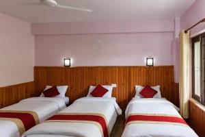 Ένα ή περισσότερα κρεβάτια σε δωμάτιο στο Hotel Monalisa Chitwan