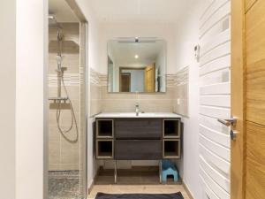 a bathroom with a sink and a mirror at Maison neuve à Grust pour 12 personnes, 4 chambres, WIFI, parking, linge et ménage inclus - FR-1-402-110 in Grust +13 photos