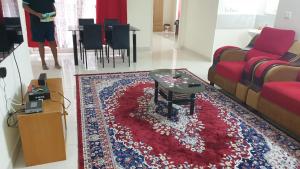 A seating area at IP Service Apartment near Chennai Airport