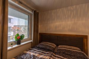 Posteľ alebo postele v izbe v ubytovaní LÉO Apartment