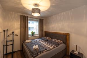 Posteľ alebo postele v izbe v ubytovaní LÉO Apartment