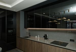 a bathroom with a sink and a large mirror at Cristal Garden Chalet in Bukovel +21 photos