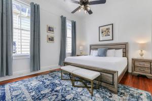 a bedroom with a bed and a window at Uptown Spacious 4BD/3BA with Historic Charm in New Orleans