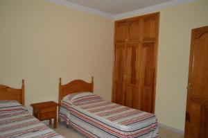 Ein Bett oder Betten in einem Zimmer der Unterkunft Casa la Ermita