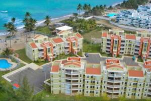 an aerial view of a resort near the beach at Fall in Love to Endless Summer. Charm and Private in Loiza