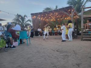 a group of people playing a game on the beach at Fall in Love to Endless Summer. Charm and Private in Loiza
