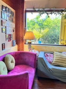 a living room with a couch and a window at DeerStar HomeStay B&B in Dongshan
