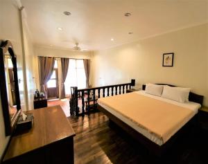 Letto o letti in una camera di Island View Beachfront Resort