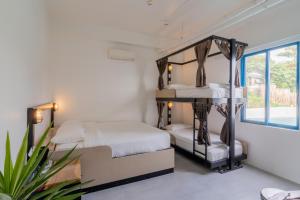Postel nebo postele na pokoji v ubytování Hop Hostel