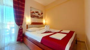 A bed or beds in a room at Apartmenthotel Sithon