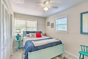 a bedroom with a bed and a ceiling fan at Cedar Creek Escape with Gas Grill and Fire Pit! in Tool