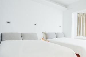Postel nebo postele na pokoji v ubytování White Space Design Hotel + 7 fotografií