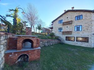 a brick oven in front of a building at Hayat Oksijen Resort in Ordu