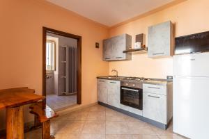 Η κουζίνα ή μικρή κουζίνα στο Bilocale Pamela climatizzato nel cuore del Salento