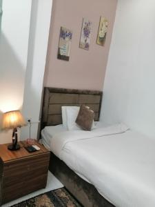 Postel nebo postele na pokoji v ubytování Gardenia Hotel
