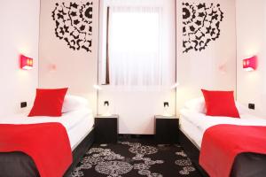 Postel nebo postele na pokoji v ubytování Hotel Zacisze