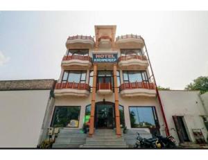 a large building with a hotel manager sign on it at Hotel Kirandeep, Agra in Agra