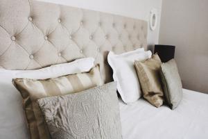 a bedroom with a bed with pillows on it at Fleur de Ré in Loix