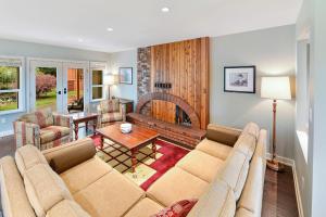 a living room with a couch and a table at Cowichan Valley Country Escape in Cobble Hill