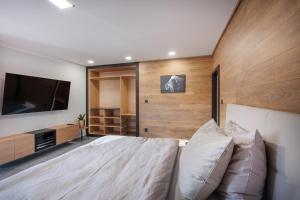 Katil atau katil-katil dalam bilik di APARTMANY L&O - Oliver