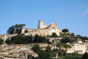 a castle on top of a hill with houses at *La Torre Di Amelia* Nel Cuore Dell' Umbria in Amelia