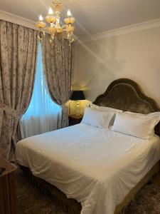 Postel nebo postele na pokoji v ubytování Ebel Boutique Hotel