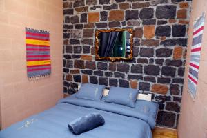 Postel nebo postele na pokoji v ubytování Onoyi Tun Guest House
