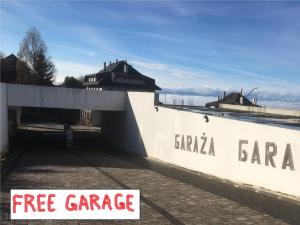 a white wall with the words fire garage on it at Apartment Deluxe Sunny Valley Milmari S8 in Kopaonik