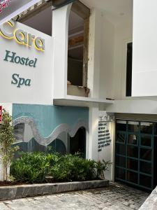 a building with a sign that reads hospital spa at Cara Hostel & Spa in Da Lat