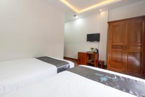 Postel nebo postele na pokoji v ubytování Cara Hostel & Spa