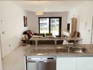 A kitchen or kitchenette at NEW GROUNDFLOOR APT. ARENALES DEL SOL