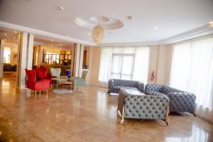Ein Sitzbereich in der Unterkunft Hôtel Millennium Kamissa