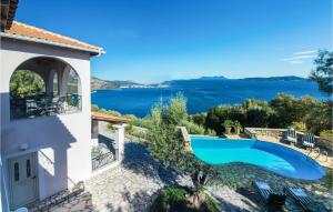 a villa with a swimming pool and a view at Villa Sophia in Évyiros
