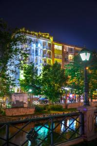 a building at night with a street light in front at Ada Life Hotel in Eskisehir