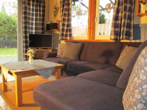 a living room with a couch and a coffee table at Haus Mika in Rott