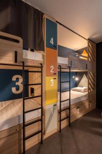 a room with two bunk beds in a room at Whoo Bordeaux Bacalan - Hostel in Bordeaux