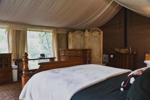 Postel nebo postele na pokoji v ubytování Silk Pavilions Glamping