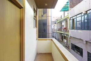 an empty hallway of a building with a window at Hotel Aeroporto in New Delhi