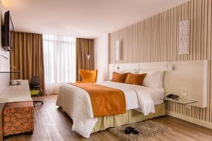 Postel nebo postele na pokoji v ubytování Radisson Hotel Curitiba