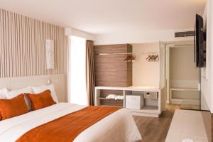 Postel nebo postele na pokoji v ubytování Radisson Hotel Curitiba
