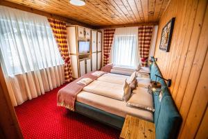 Postel nebo postele na pokoji v ubytování KITZALPEN Pension