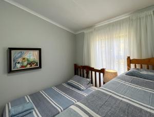 Postel nebo postele na pokoji v ubytování Voelroepersfontein
