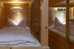 Letto o letti in una camera di Skihütte Zams