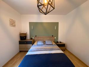 Ένα ή περισσότερα κρεβάτια σε δωμάτιο στο Appartement T3 aux portes de Rodez